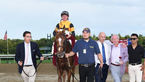 Carson's Run entering the winner's circle after the Saratoga Derby