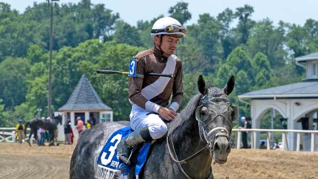 Deputed Testamony winner Post Time and jockey Sheldon Russell