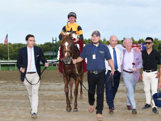 Carson's Run entering the winner's circle after the Saratoga Derby