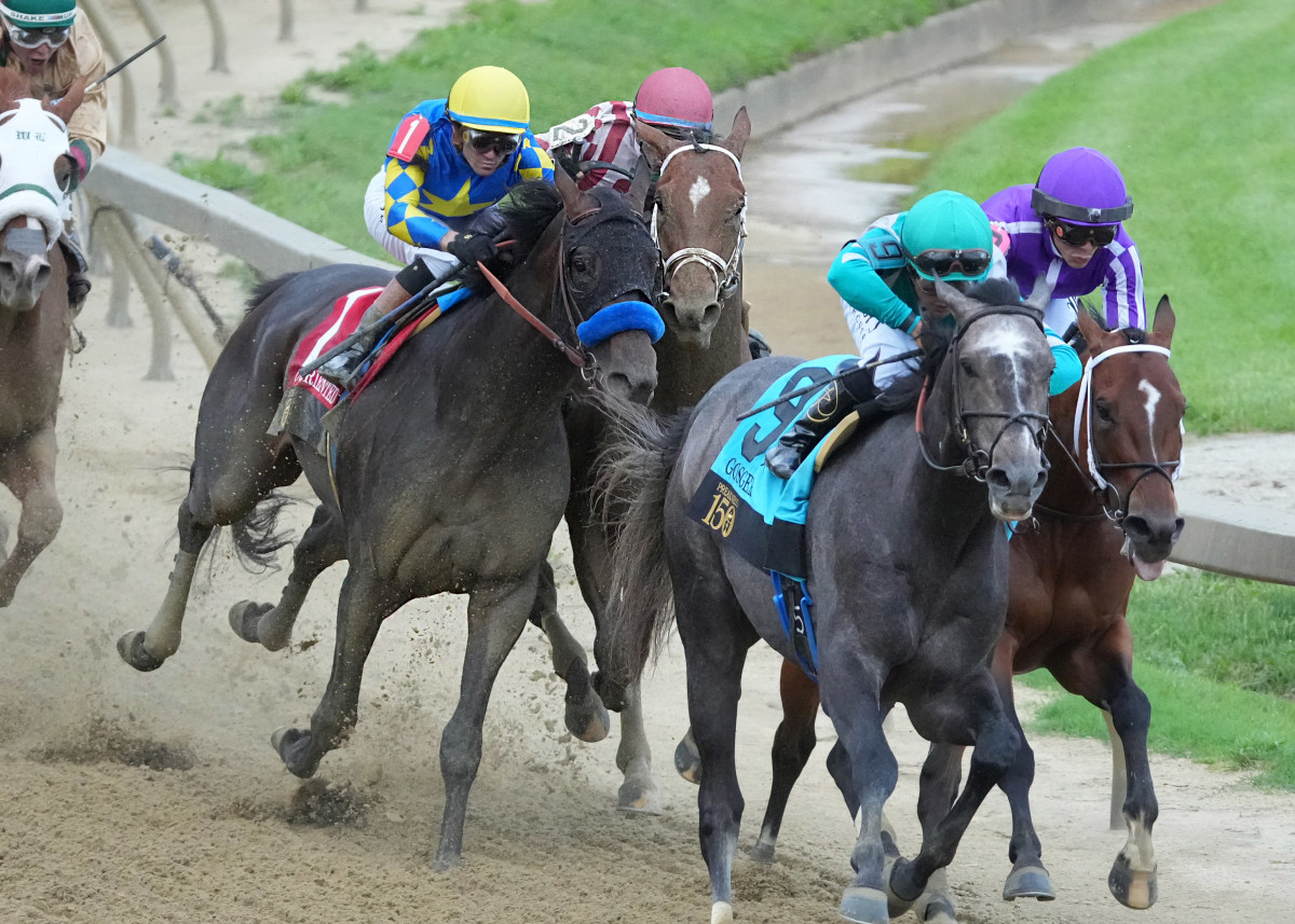 Journalism fights for racing room at the top of the stretch in the Preakness inside of Goal Oriented and behind Gosger and Clever Again